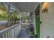 Cozy front porch with white railings, green door, and space for outdoor seating at 196 Wadley Nw St, Atlanta, GA 30314