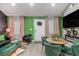 Open living room with green accent walls, modern furniture, and ample natural light at 196 Wadley Nw St, Atlanta, GA 30314