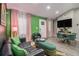 Stylish living room featuring green accent walls, modern furniture, and a decorative fireplace at 196 Wadley Nw St, Atlanta, GA 30314