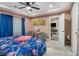Comfortable bedroom features a tray ceiling and view to the open plan living area at 196 Wadley Nw St, Atlanta, GA 30314