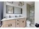 Bathroom with double vanity, modern fixtures, granite counters, and glass shower at 1968 8Th St, Chamblee, GA 30341