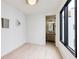 Bright bedroom featuring sleek windows, modern light fixture, and light hardwood floors at 1968 8Th St, Chamblee, GA 30341