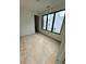 Bright bedroom with large windows, and light hardwood floors ready for finishing at 1968 8Th St, Chamblee, GA 30341