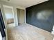 Spacious bedroom with an accent wall, hardwood floors, and a sliding closet door at 1968 8Th St, Chamblee, GA 30341