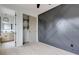 Bedroom with modern wall accents, a ceiling fan, light floors, and a closet at 1968 8Th St, Chamblee, GA 30341