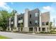 Modern townhome featuring a mixed material facade and manicured landscaping at 1968 8Th St, Chamblee, GA 30341