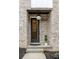 Charming front entrance with a black door, modern house numbers, and manicured landscaping at 1968 8Th St, Chamblee, GA 30341