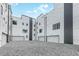 A parking area shows rows of private garages with white doors at 1968 8Th St, Chamblee, GA 30341