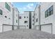 A parking area shows rows of private garages with white doors at 1968 8Th St, Chamblee, GA 30341