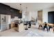 Well-lit kitchen featuring black and wood cabinets, stainless steel appliances, and a center island with seating at 1968 8Th St, Chamblee, GA 30341