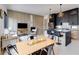Open-concept living area combining a kitchen, dining area, and cozy seating space with paneling and modern decor at 1968 8Th St, Chamblee, GA 30341
