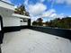 Modern roof deck with black railing overlooking trees and a blue sky at 1968 8Th St, Chamblee, GA 30341