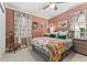 Cozy bedroom features a ceiling fan, plush bedding, neutral carpeting and a window at 1998 Jordan Terrace Ne, Atlanta, GA 30345