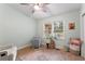 Bright bedroom with large window, neutral carpet, rocking chair and decor at 1998 Jordan Terrace Ne, Atlanta, GA 30345