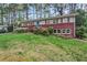 Attractive home with brick accents, well-maintained lawn, and blooming shrubs at 1998 Jordan Terrace Ne, Atlanta, GA 30345