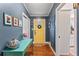 Inviting foyer featuring hardwood floors, stylish decor, and a bright yellow door at 1998 Jordan Terrace Ne, Atlanta, GA 30345