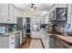 Well-equipped kitchen with stainless steel appliances, white cabinets, and granite countertops at 1998 Jordan Terrace Ne, Atlanta, GA 30345