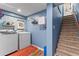 Laundry room with blue walls and a set of stairs at 1998 Jordan Terrace Ne, Atlanta, GA 30345