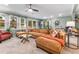 Bright living room featuring a large sectional sofa, ceiling fan and lots of natural light at 1998 Jordan Terrace Ne, Atlanta, GA 30345