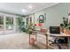 Bright home office featuring an oversized desk, perfect for a dedicated workspace with access to the backyard at 1998 Jordan Terrace Ne, Atlanta, GA 30345
