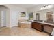 Well-lit bathroom with granite countertops, a corner bathtub, and tile flooring at 3597 Old Maple Rd, Johns Creek, GA 30022