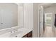 Bathroom vanity featuring a large mirror, spacious sink, and plenty of counter space at 3597 Old Maple Rd, Johns Creek, GA 30022