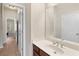 Bathroom boasts a sleek vanity, spacious mirror, and neutral tones, creating a bright and inviting space at 3597 Old Maple Rd, Johns Creek, GA 30022