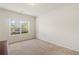 Bright bedroom featuring a neutral palette, large window, and plush carpeting, creating a serene retreat at 3597 Old Maple Rd, Johns Creek, GA 30022