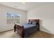 Cozy bedroom features natural light, plush carpeting and a comfortable bed, perfect for relaxation at 3597 Old Maple Rd, Johns Creek, GA 30022