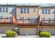 Back exterior of townhomes with garages and decks, ideal for parking and outdoor living at 4899 Seldon Se Way, Smyrna, GA 30080