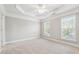 Spacious bedroom with tray ceiling, ceiling fan, neutral walls, carpeted flooring and double windows at 4899 Seldon Se Way, Smyrna, GA 30080