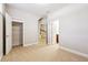 Bedroom with carpeted floor and three doors for closet, hall and possible bathroom access at 4899 Seldon Se Way, Smyrna, GA 30080