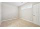 Bright bedroom with neutral carpet, white trim, and a window providing natural light at 4899 Seldon Se Way, Smyrna, GA 30080