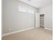 Cozy bedroom features neutral walls, carpet, and a closet with built-in shelving for storage at 4899 Seldon Se Way, Smyrna, GA 30080