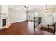 Spacious living room with hardwood floors, fireplace, and doors leading to a balcony at 4899 Seldon Se Way, Smyrna, GA 30080