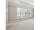 Spacious main bedroom with large windows and a tray ceiling at 4899 Seldon Se Way, Smyrna, GA 30080