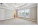 Spacious bedroom with tray ceiling and large windows at 4899 Seldon Se Way, Smyrna, GA 30080