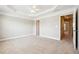 Spacious bedroom with tray ceiling and carpeted floor at 4899 Seldon Se Way, Smyrna, GA 30080