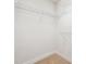 Walk-in closet with carpeted floor and white metal shelving installed for optimal storage convenience at 4899 Seldon Se Way, Smyrna, GA 30080