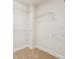 A walk-in closet with carpeted floor and white metal shelving installed for optimal storage convenience at 4899 Seldon Se Way, Smyrna, GA 30080