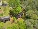 Property aerial view revealing lush tree coverage and two structures at 1061 Pathfinder Rd, Marietta, GA 30066