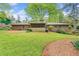 Well-maintained backyard with mature trees and green lawn space at 1061 Pathfinder Rd, Marietta, GA 30066