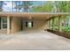 Covered carport featuring brick and siding details, offering ample parking space and protection from the elements at 1061 Pathfinder Rd, Marietta, GA 30066