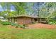 Charming brick home featuring a covered carport and lush landscaping at 1061 Pathfinder Rd, Marietta, GA 30066