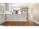 Bright kitchen showcasing white cabinets, stainless appliances, and gleaming hardwood flooring at 1061 Pathfinder Rd, Marietta, GA 30066