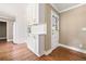 Kitchen boasting white cabinets, modern hardware, and beautiful hardwood floors at 1061 Pathfinder Rd, Marietta, GA 30066