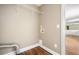 Functional laundry room with washer hookups and a wire shelf for organized storage at 1061 Pathfinder Rd, Marietta, GA 30066