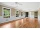 Bright and spacious living room with hardwood floors, elegant trim, and ample natural light from large windows at 1061 Pathfinder Rd, Marietta, GA 30066