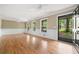 Bright and spacious living room with hardwood floors, elegant trim, and ample natural light from large windows at 1061 Pathfinder Rd, Marietta, GA 30066
