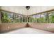 Bright sunroom enclosed with windows offers a view of the private backyard at 1061 Pathfinder Rd, Marietta, GA 30066